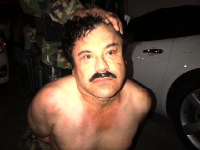 A manhunt was launched to find Mexican drug kingpin Joaquin "El Chapo" Guzman after he escaped from prison, Mexico's National Security Commission said in a statement Saturday, July 11, 2015. Guards at the Altiplano Federal Prison found that Guzman was missing during routine check. This photograph shows Guzman during a February, 2014 arrest.