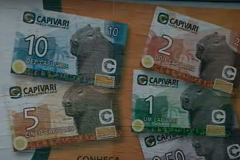 Moedas sociais são usadas em pequenas cidades do país (Foto: YouTube/Reprodução)
