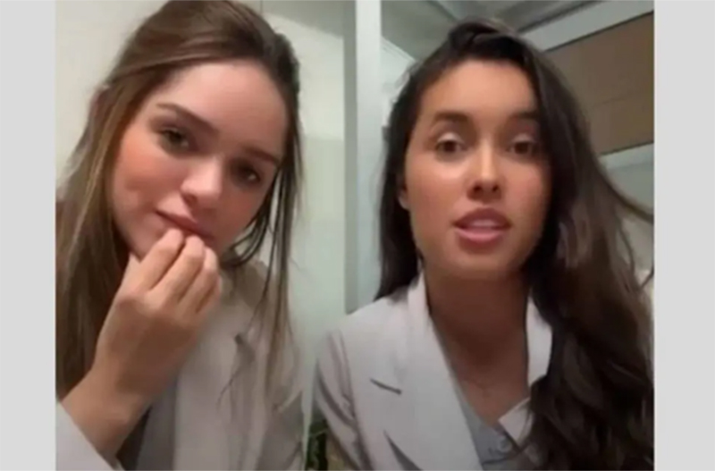Gabrielli Farias de Souza e Thais Caldeiras Soares Foffano irornizam paciente em vídeo na rede social (Imagem: CNN/YouTube/Reprodução)